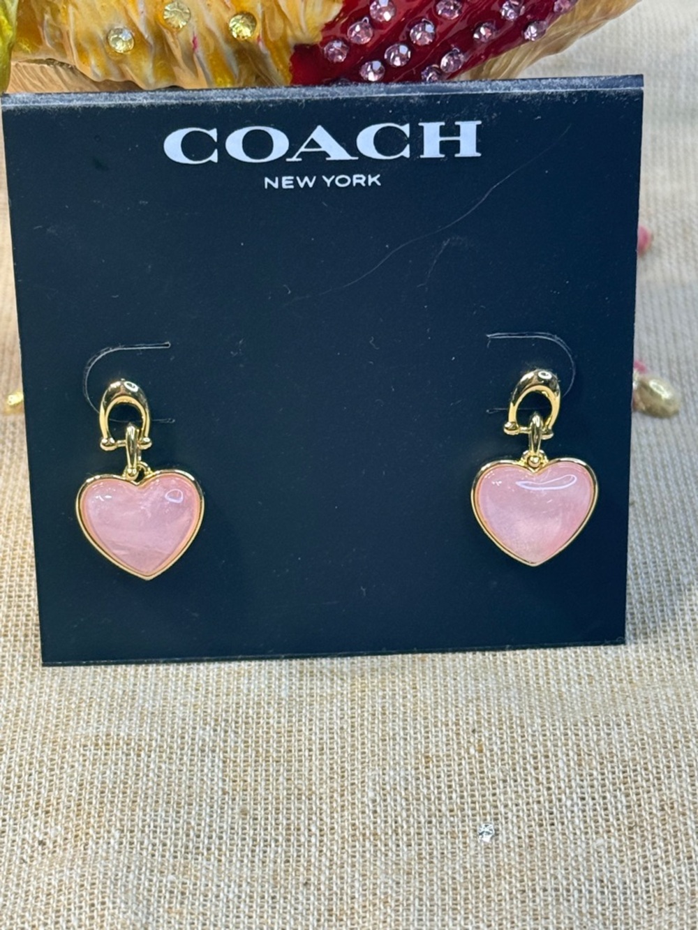Coach Gold-Tone Earrings with Pale Pink Heart Drops